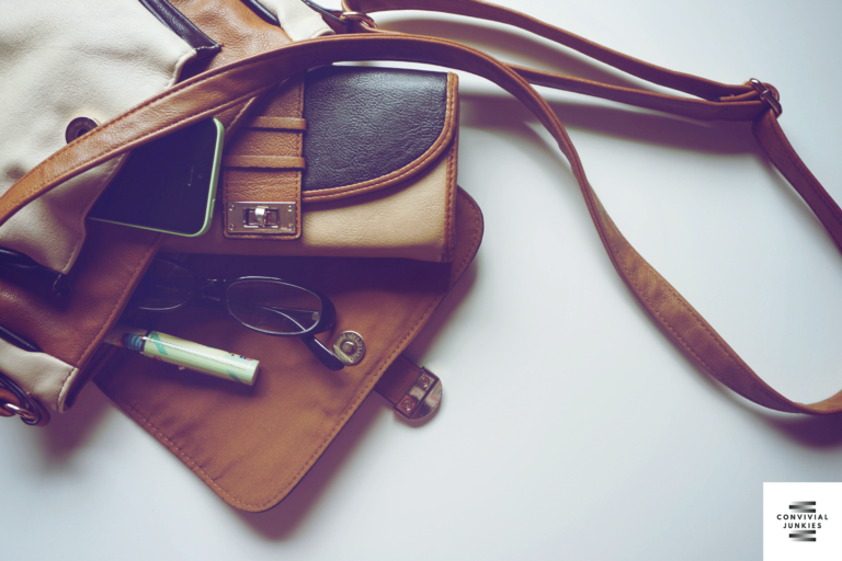 Photo of a sturdy travel bag along with the logo of convivialjunkies.com prominently displayed, representing the best travel accessories for your next adventure.